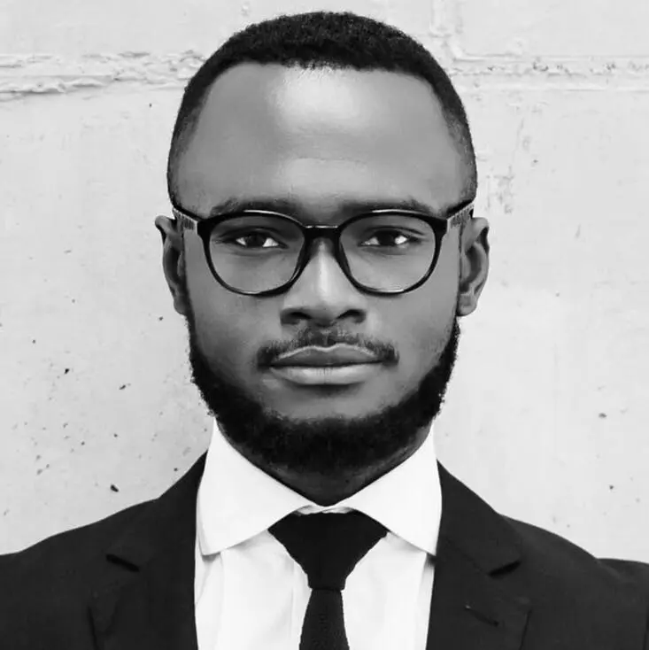 pexels-photo-935969-935969 Elegant black and white photo of a man in glasses and suit, showcasing modern style.